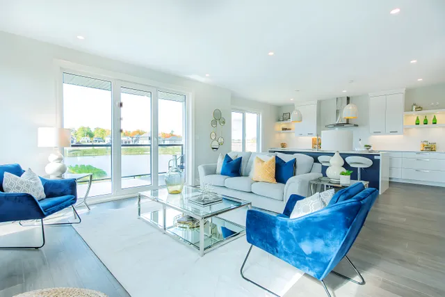 Living room on polished porcelain with large windows and the lake beyond