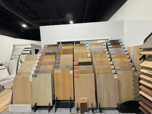 Full-size plank samples on the racks of the Aldergate Surfaces showroom